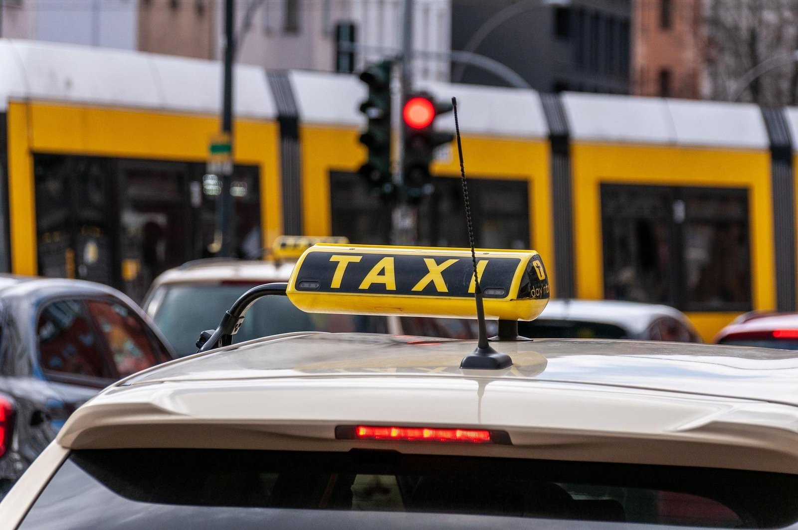 Family arriving at airport with taxi